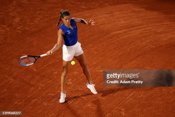 Chloe Paquet of France plays a forehand against Aryna Sabalenka during the Women's Singles First Round match on Day 3 of the French Open at Roland...