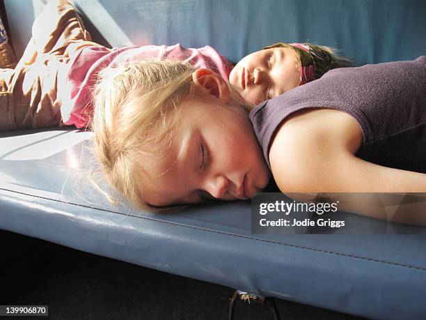 two children sleeping on train seat - train interior stock pictures, royalty-free photos & images