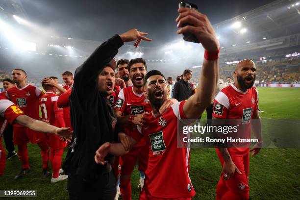 Players of 1. FC Kaiserslautern celebrate their team's victory towards their fans at full-time after the Second Bundesliga Playoffs Leg Two match...