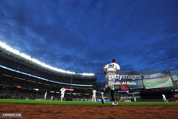 Aaron Judge of the New York Yankees jogs to the outfield between innings against the Baltimore Orioles during their game at Yankee Stadium on May 24,...
