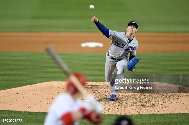 Walker Buehler of the Los Angeles Dodgers pitches to Lane Thomas of the Washington Nationals in the fourth inning at Nationals Park on May 24, 2022...