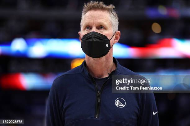 Head coach Steve Kerr of the Golden State Warriors looks on during the national anthem prior to Game Four of the 2022 NBA Playoffs Western Conference...