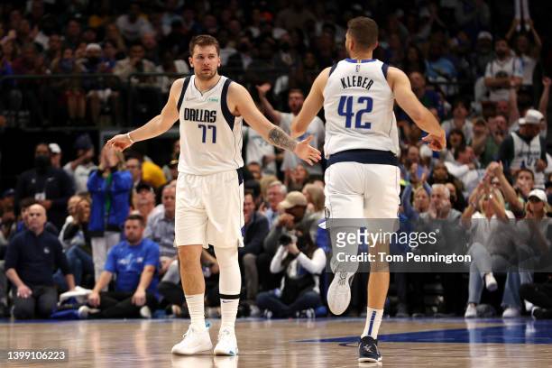 Luka Doncic and Maxi Kleber of the Dallas Mavericks celebrate a basket during the second quarter against the Golden State Warriors in Game Four of...