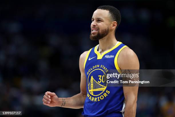 Stephen Curry of the Golden State Warriors reacts to a play during the second quarter against the Dallas Mavericks in Game Four of the 2022 NBA...