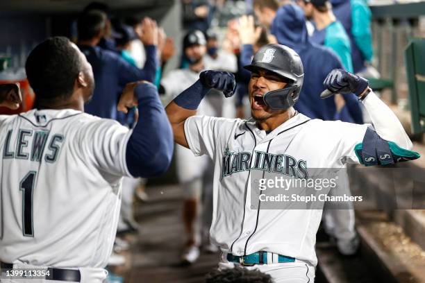 Julio Rodriguez of the Seattle Mariners celebrates with Kyle Lewis after hitting a two-run home run during the fifth inning against the Oakland...