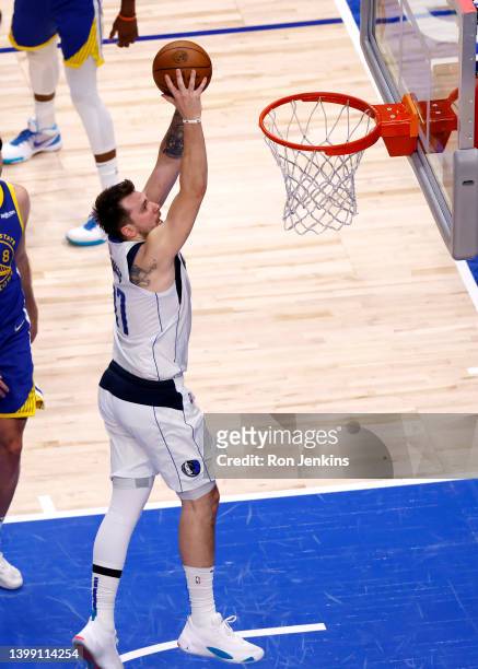 Luka Doncic of the Dallas Mavericks dunks the ball during the fourth quarter against the Golden State Warriors in Game Four of the 2022 NBA Playoffs...