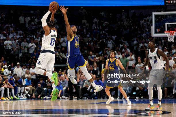 Jalen Brunson of the Dallas Mavericks grabs the ball against Moses Moody of the Golden State Warriors during the fourth quarter in Game Four of the...