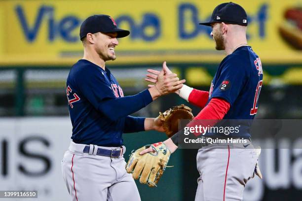 Enrique Hernandez and Trevor Story of the Boston Red Sox celebrate the 16-3 win against the Chicago White Sox at Guaranteed Rate Field on May 24,...