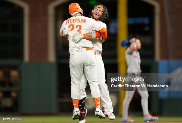 Brandon Crawford and Joc Pederson of the San Francisco Giants celebrates after Crawford hit a walk-off RBI single scoring Darin Ruf to defeat the New...