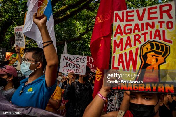 Anti-Marcos activists take part in a protest against election results at the Commission on Human Rights office on May 25, 2022 in Quezon city, Metro...