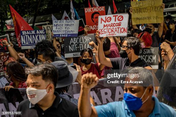 Anti-Marcos activists take part in a protest against election results at the Commission on Human Rights office on May 25, 2022 in Quezon city, Metro...