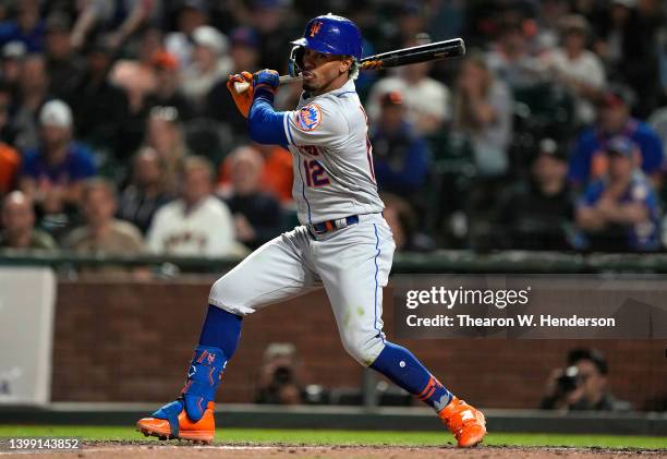 Francisco Lindor of the New York Mets hits a bases loaded three-run rbi triple against the San Francisco Giants in the top of the eighth inning at...