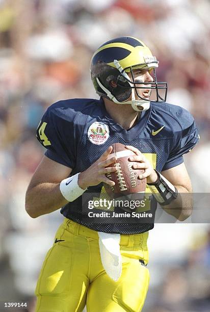 Quarterback Brian Griese of the Michigan Wolverines prepares to pass the ball during the Outback Bowl game against the Alabama Crimson Tide at Tampa...