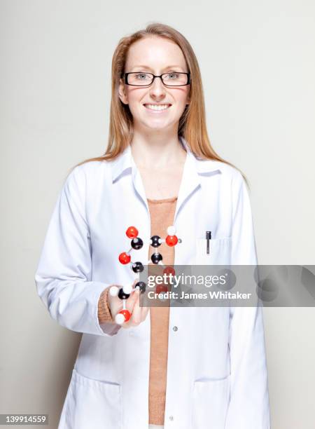 female scientist presents molecular model - chemistry model stock pictures, royalty-free photos & images