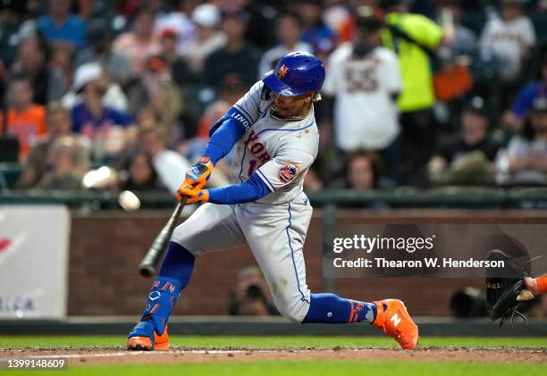 Francisco Lindor of the New York Mets hits a sacrifice fly scoring Tomas Nido against the San Francisco Giants in the top of the fifth inning at...