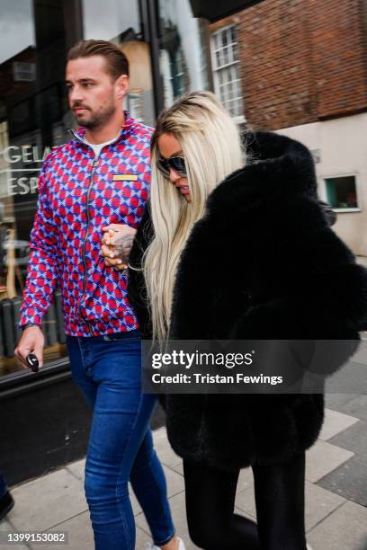 Katie Price and Carl Woods attend Lewes Crown Court on May 25, 2022 in Lewes, England. British model and media personality Katie Price is in court to...