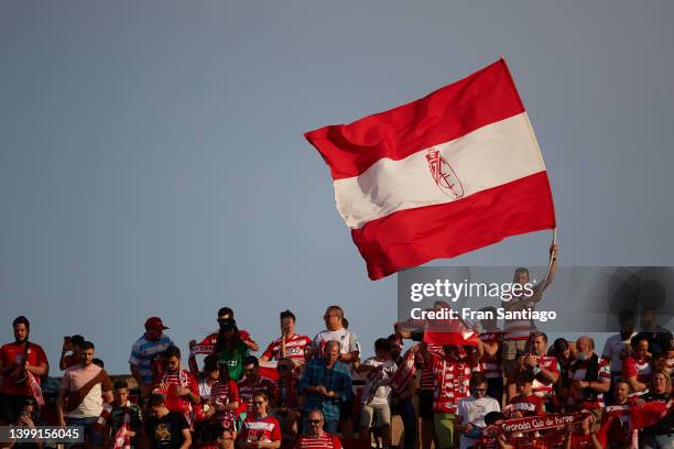 Fans of Granada CF wave a flag during the LaLiga Santander match between Granada CF and RCD Espanyol at Nuevo Estadio de Los Carmenes on May 22, 2022...