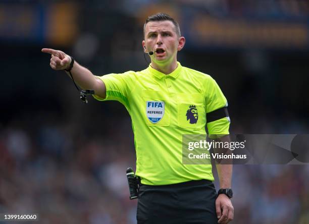 Referee Michael Oliver during the Premier League match between Manchester City and Aston Villa at Etihad Stadium on May 22, 2022 in Manchester,...