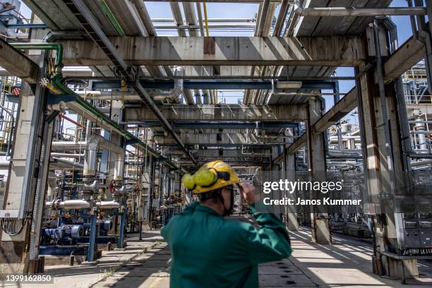 An employee inspects processing and refining structures in the Duna oil refinery on May 24, 2022 in Szazhalombatta, Hungary. MOL Hungarian Oil & Gas...