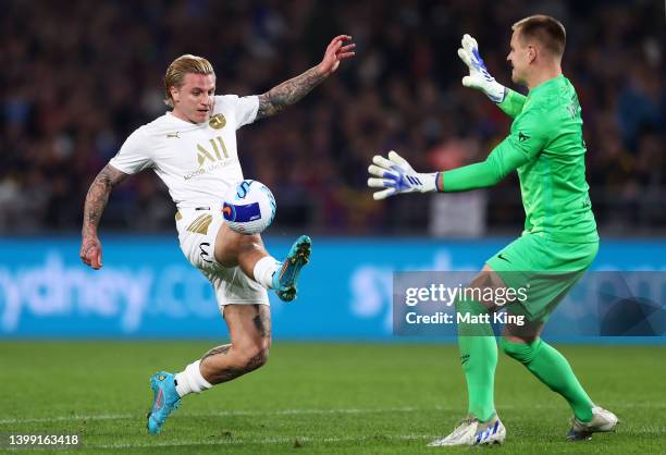 Jason Cummings of the All Stars takes a shot on goal as FC Barcelona goalkeeper Marc-Andre ter Stegen defends during the match between FC Barcelona...