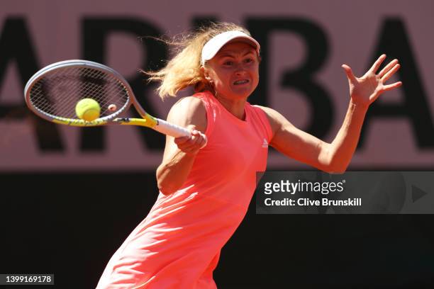 Aliaksandra Sasnovich of Belarus plays a forehand against Emma Raducanu of Great Britain during the Women's Singles Round 2 on Day Four of The 2022...