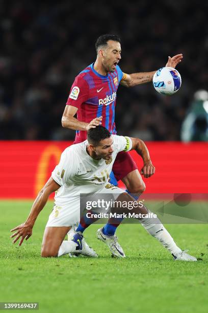 Sergio Busquets of FC Barcelona and Jack Rodwell of the All Stars compete for the ball during the match between FC Barcelona and the A-League All...