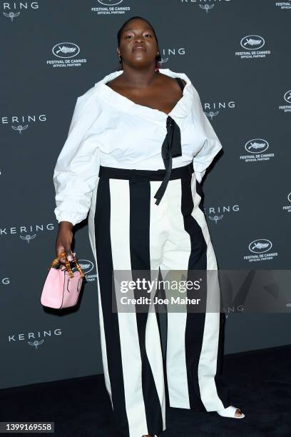 Deborah Lukumuena attends the photocall for Kering Women In Motion Talks: Deborah Lukumuena during the 75th annual Cannes film festival at Majestic...