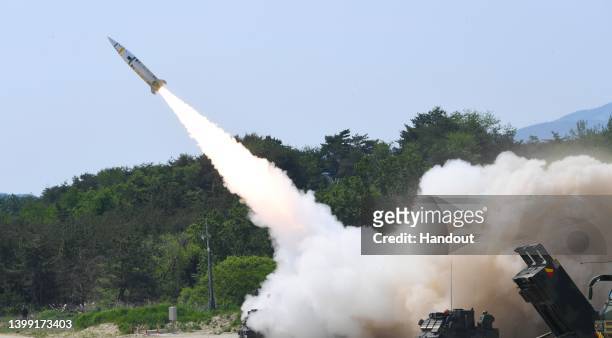 In this handout photo released by the South Korean Defense Ministry, a missile is fired during a U.S. And South Korea joint training exercise to fire...