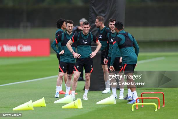 James Milner of Liverpool looks on during a training session at AXA Training Centre on May 25, 2022 in Kirkby, England.