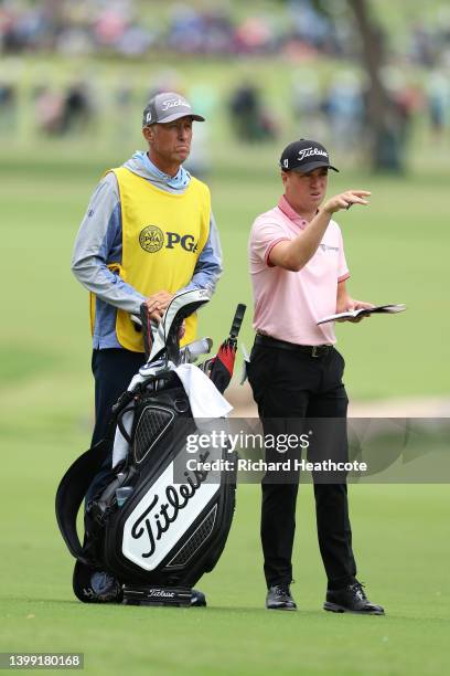 Justin Thomas of the USA and caddie Jim "Bones" Mackay in action during the final round of the USPGA Championship at Southern Hills Country Club on...