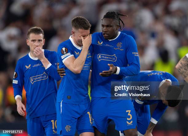 Aaron Ramsey of Rangers FC reacts after missing his penalty in the shoot out as Calvin Bassey consoles him during the UEFA Europa League final match...