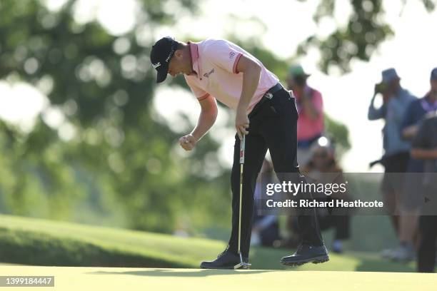 Justin Thomas of the United States reacts to his winning putt on the 18th hole, the third playoff hole during the final round of the USPGA...