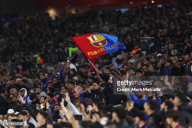 Fan waves a Barcelona flag during the match between FC Barcelona and the A-League All Stars at Accor Stadium on May 25, 2022 in Sydney, Australia.