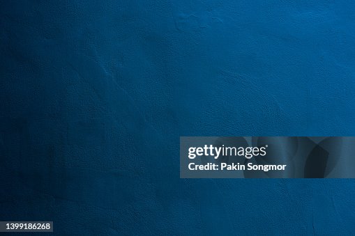 Dark blue color with an old grunge wall concrete texture as a background. Dark blue color with an old grunge wall concrete texture as a background.