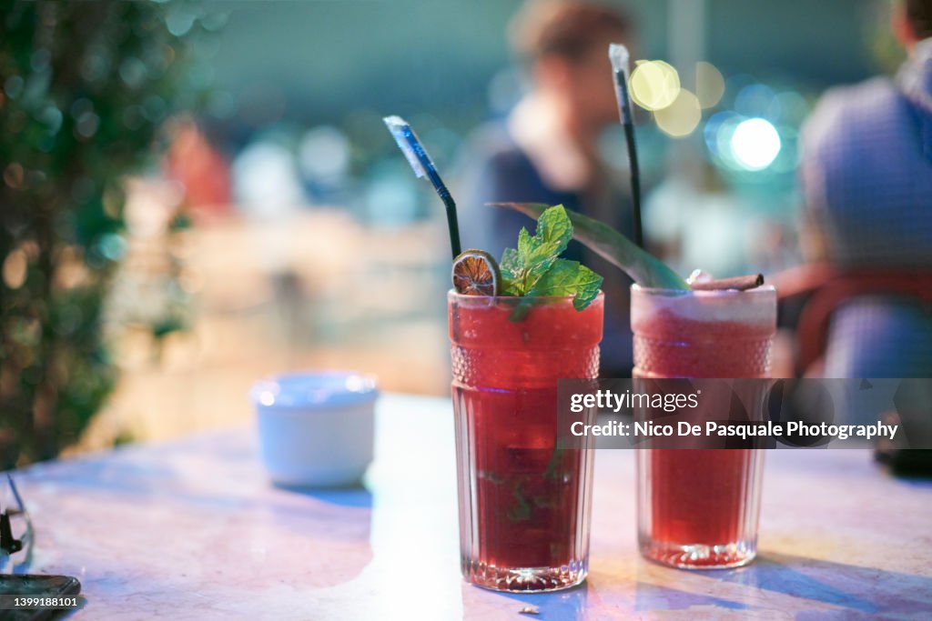 Raspberry Mojito And Cherry Caipirinha Cocktails