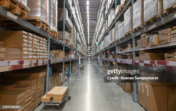 Shelve with boxes in modern factory warehouse.