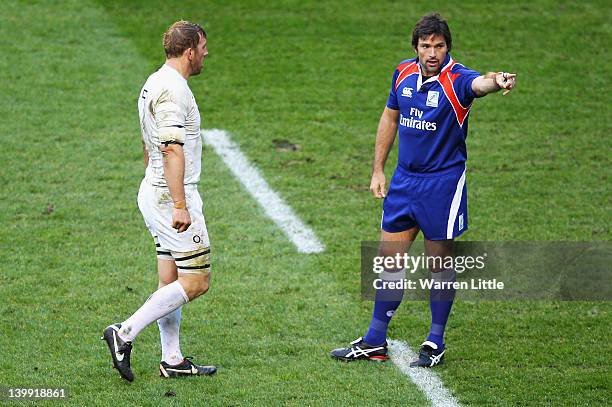 Referee Steve Walsh gives a decision watched by Chris Robshaw of England during the RBS 6 Nations match between England and Wales at Twickenham...