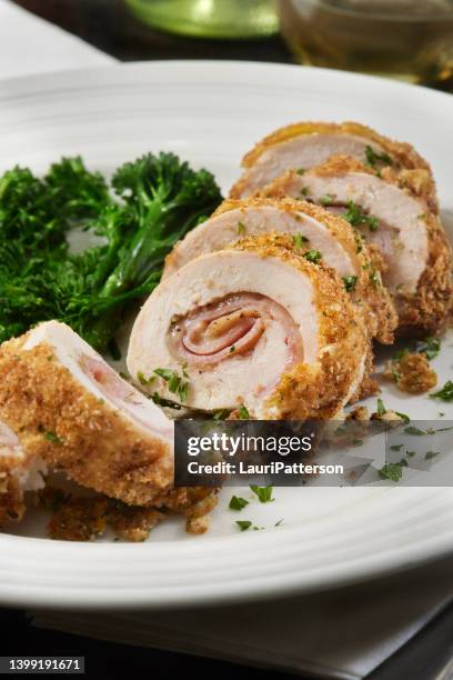 crispy baked chicken cordon bleu - kalkonbröst bildbanksfoton och bilder