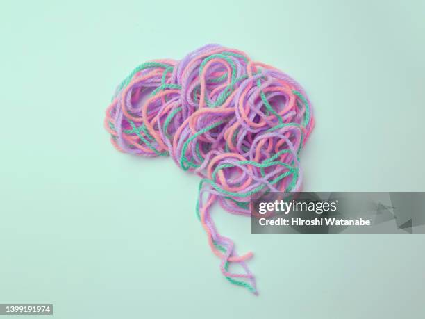 brains made of colorful yarns intertwined - yarn stock pictures, royalty-free photos & images