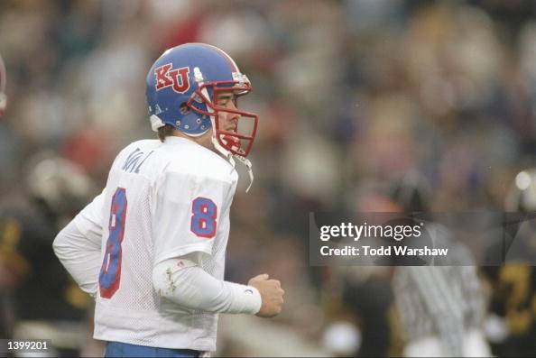 Quarterback Ben Rutz of the Kansas Jayhawks stands on the field... News ...