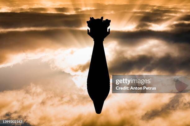 air bomb against the sunset sky - missile strike stock pictures, royalty-free photos & images