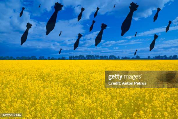 air bomb on the background of the flag of ukraine - ukraine russia conflict stock pictures, royalty-free photos & images