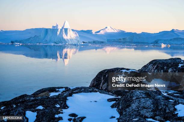 Ilulissat, Greenland Icebergs, calved from the Sermeq Kujalleq glacier, float in the Ilulissat Icefjord. 2022 will mark one of the biggest ice melt...