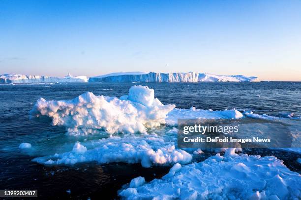 Ilulissat, Greenland Icebergs, calved from the Sermeq Kujalleq glacier, float in the Ilulissat Icefjord. 2022 will mark one of the biggest ice melt...