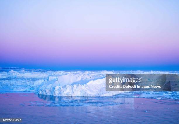 Ilulissat, Greenland Icebergs, calved from the Sermeq Kujalleq glacier, float in the Ilulissat Icefjord. 2022 will mark one of the biggest ice melt...
