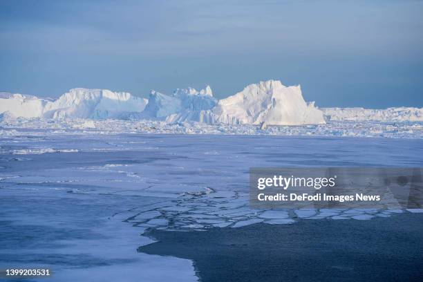 Ilulissat, Greenland Icebergs, calved from the Sermeq Kujalleq glacier, float in the Ilulissat Icefjord. 2022 will mark one of the biggest ice melt...