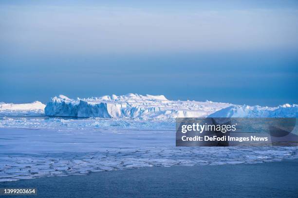 Ilulissat, Greenland Icebergs, calved from the Sermeq Kujalleq glacier, float in the Ilulissat Icefjord. 2022 will mark one of the biggest ice melt...