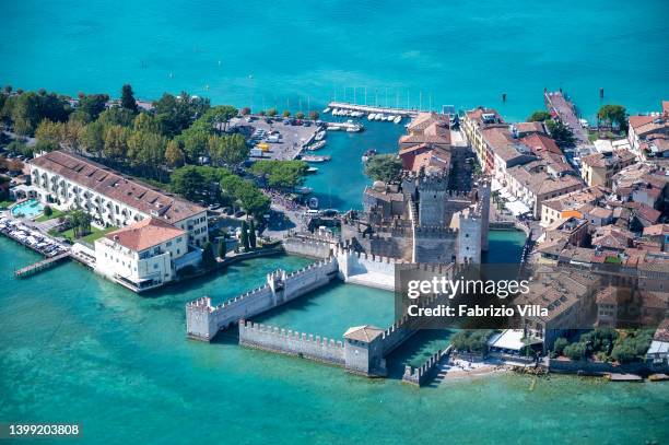 Aerial view, from a helicopter, The Scaliger Castle in Sirmione is a fortress from the Scaliger era, the access point to the historic centre of...