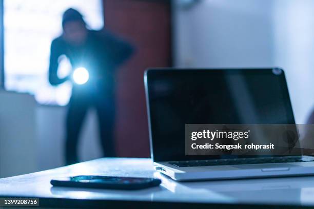 intrusion of a burglar in a house inhabited - bankräuber stock-fotos und bilder