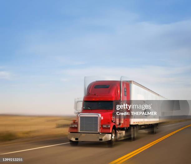 refrigerated red semi trailer transporting commercial cargo - panning motion blur - refrigerator truck stock pictures, royalty-free photos & images